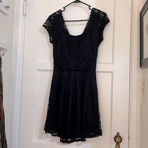 Lightweight, lacy mini dress with x-style back.